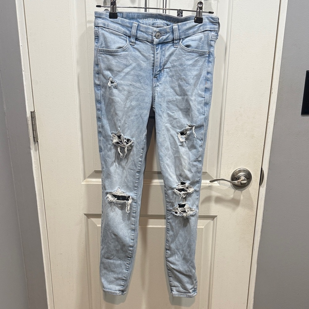 American Eagle Next Level Stretch Light Blue Distressed Curvy High Rise Jegging